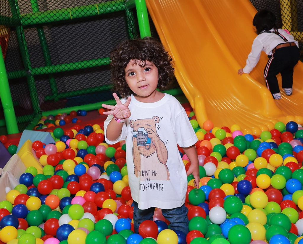 A boy is playing in soft play area